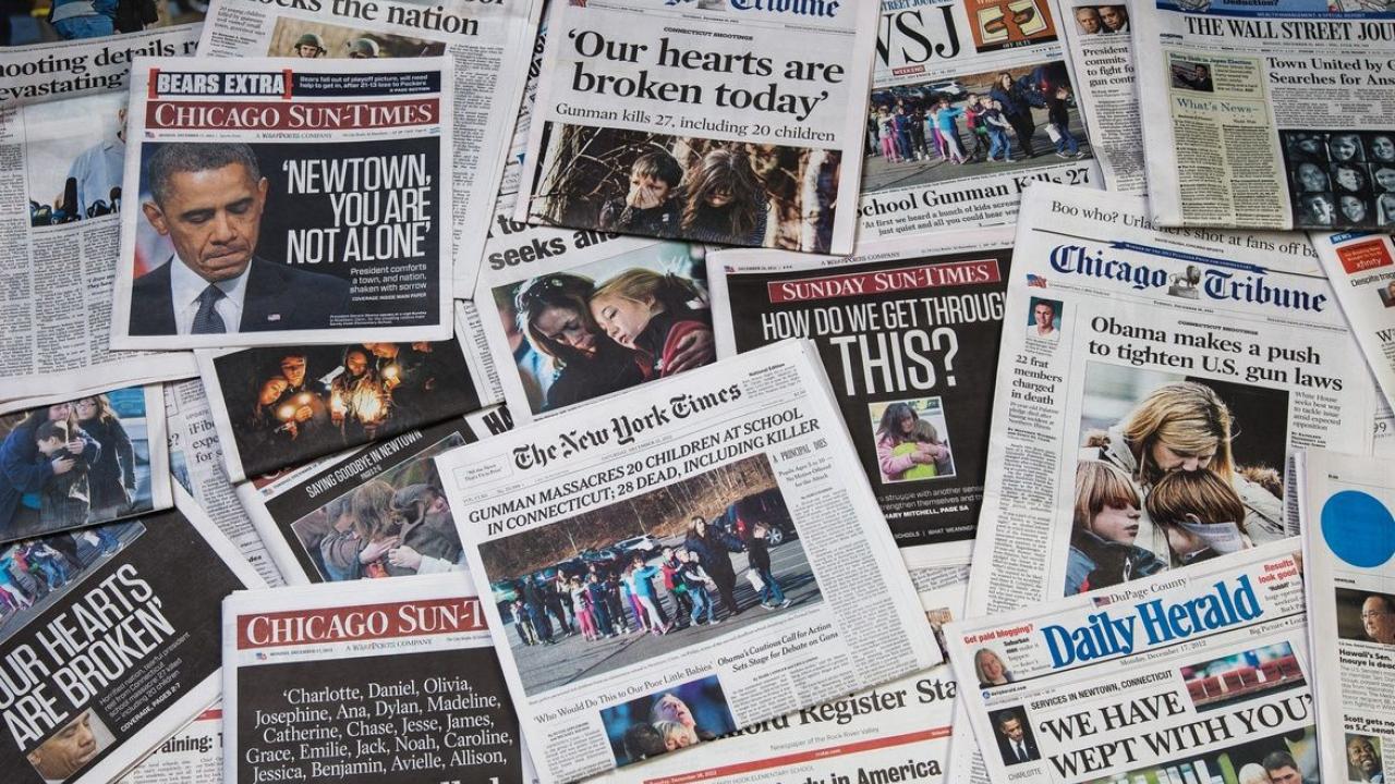 Newpapers showing headlines of school shootings