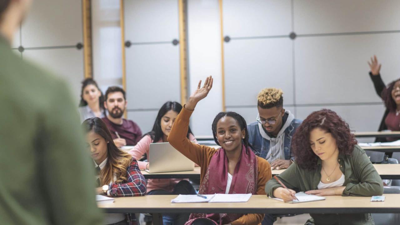 A group of students listening to presentations