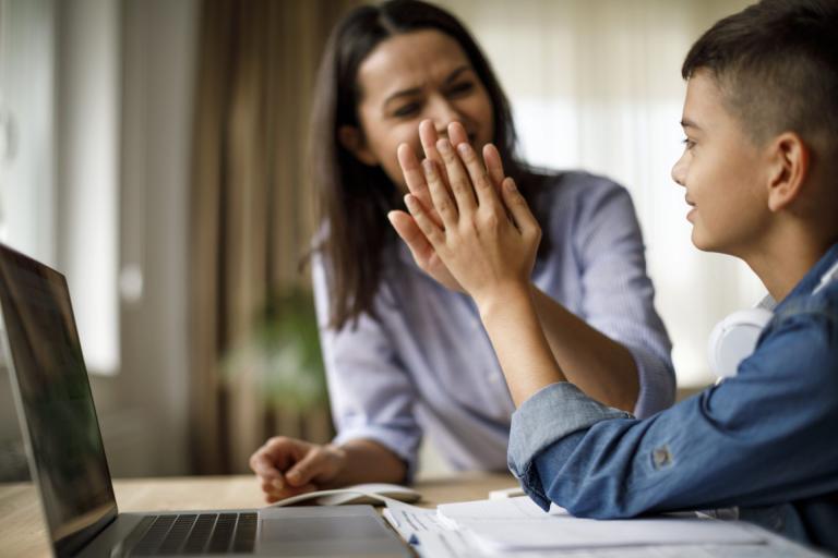 parent high-fiving child